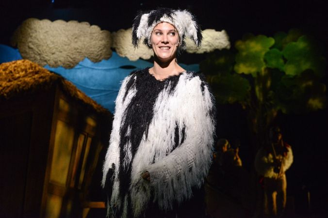 'Fly' the sheep is a black and white sheepdog, and she looking at the audience smiling
