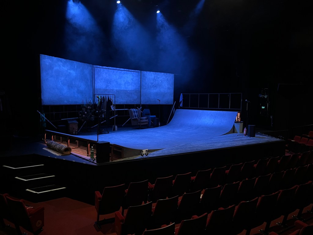 shows a picture of the stage before the show, and the view from my seat.